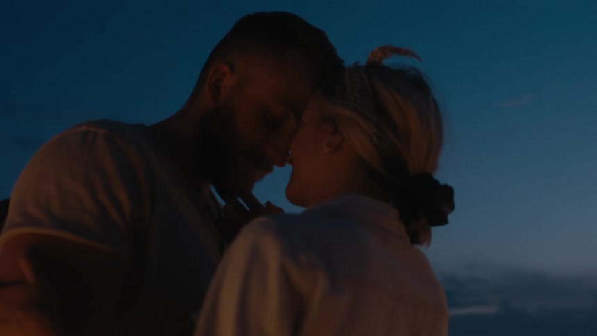 Couple slow dancing outdoors under the night sky