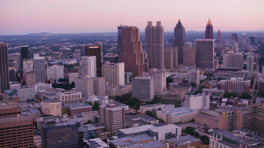 Tall skyscrapers loom over shorter buildings downtown
