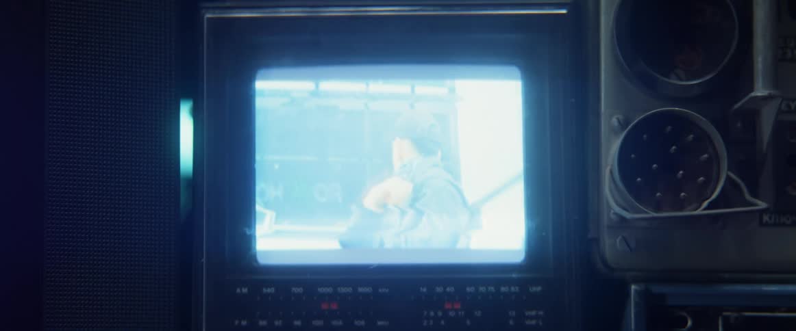 A man is seen on the screen of an old monitor