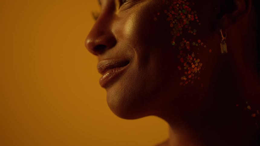 Close up of a woman is in a room and smiling