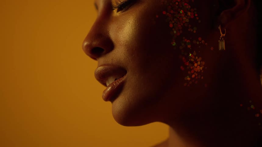 Close up view of a woman wearing jewelry is displayed