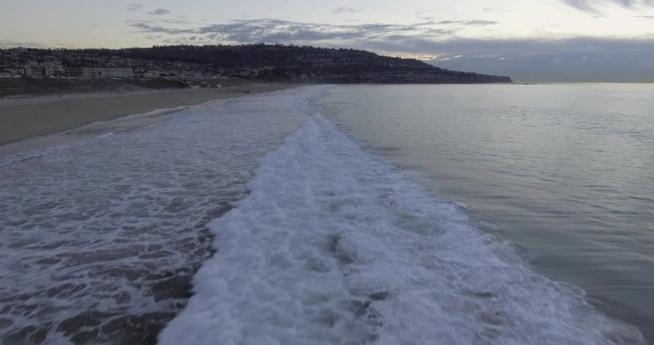 Small waves are crashing towards the shore