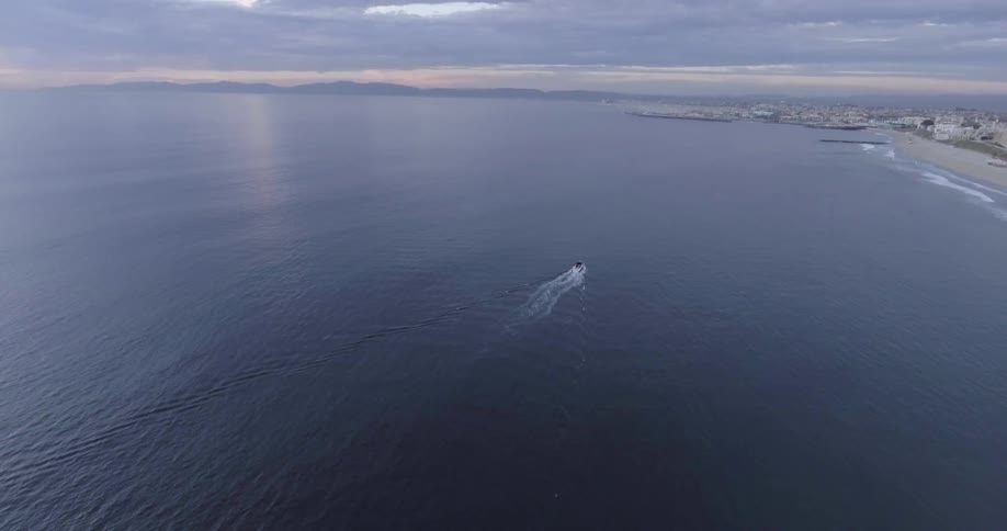 Aerial view of a boat traveling in the water
