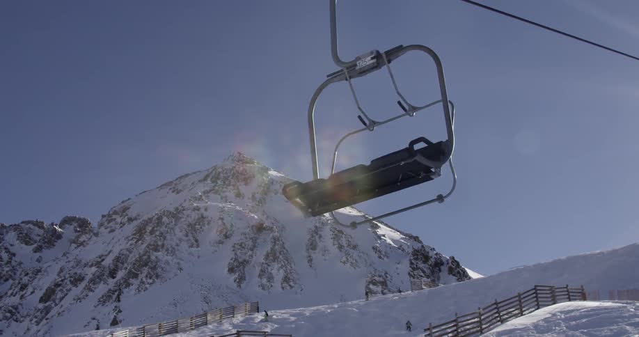 An empty ski lift on a mountain