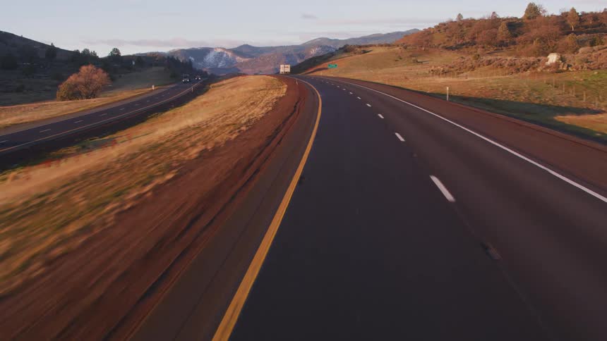 Vehicles travel on the highway