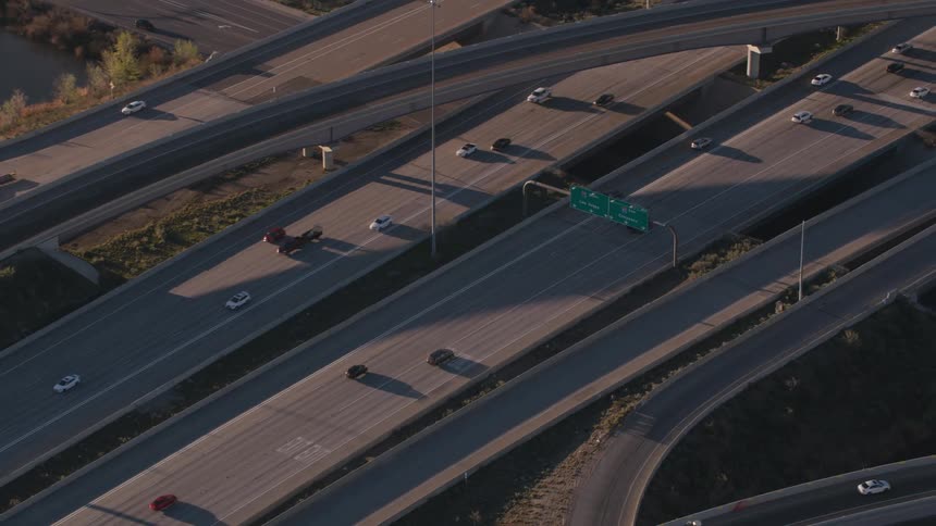 Heavy traffic passes down a busy freeway system