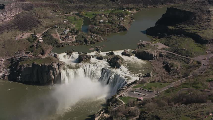 The waterfall is raging near the hills