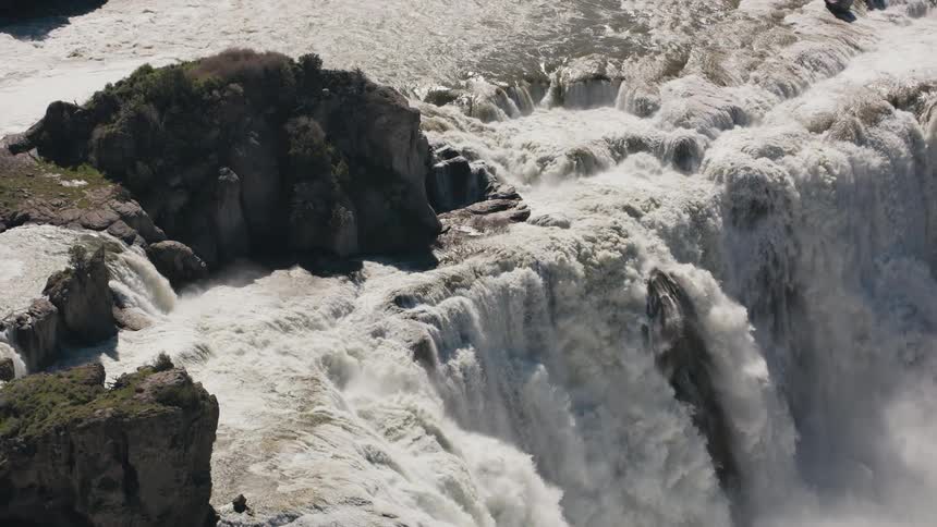 The river pours out into the waterfall