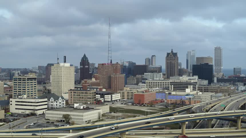 Traffic drives by downtown Milwaukee