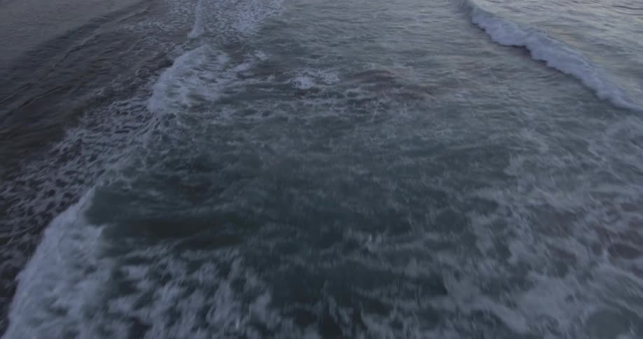 Waves roll onto a beach
