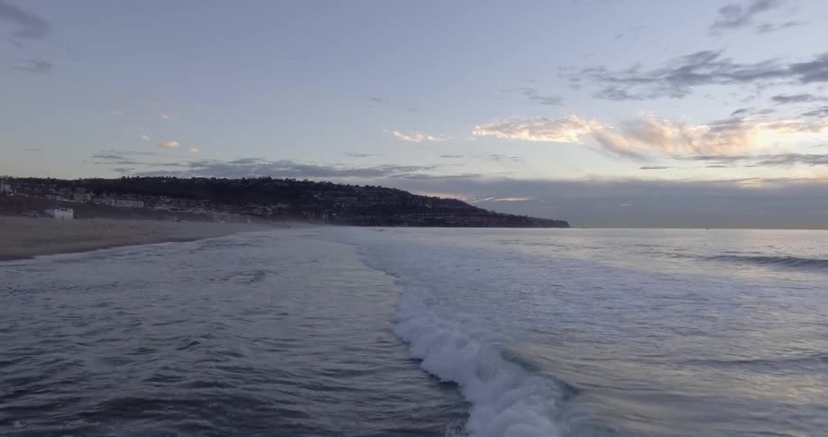 Waves are crashing on a beach