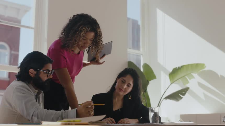 Coworkers talk in the office