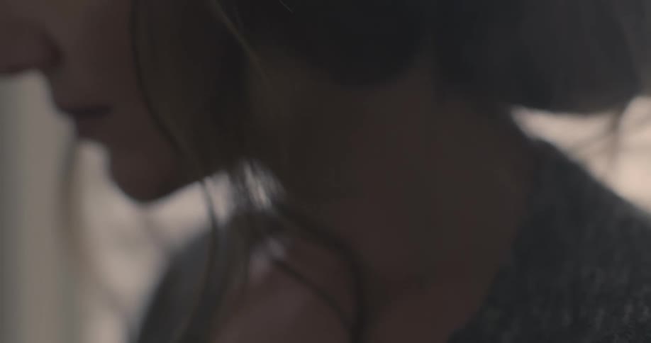 A woman is holding a pregnancy test in her hands