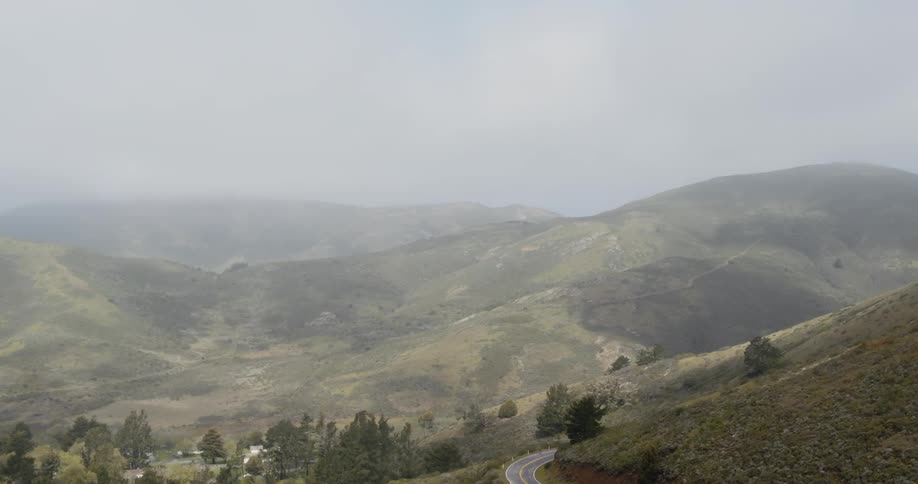 Aerial view of mountain road with green mountains