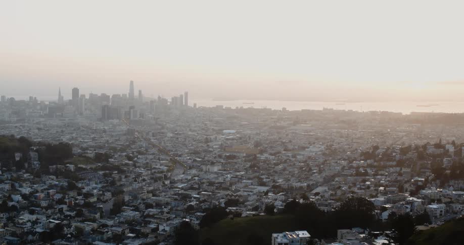 Fog covers the city ahead