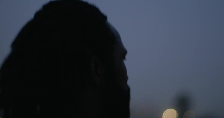 Close up of a mans face as he runs outside
