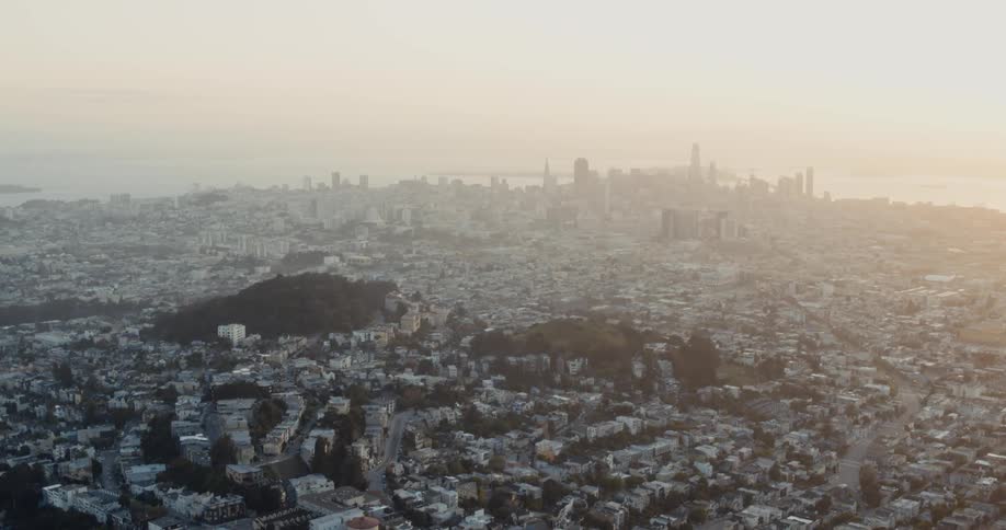 Aerial view of tall skyscrapers on the skyline of the a city downtown under the mist at morning