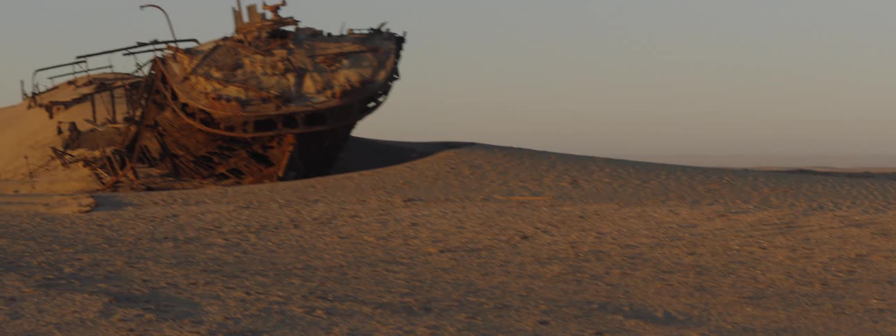 Rusted shipwreck in the desert