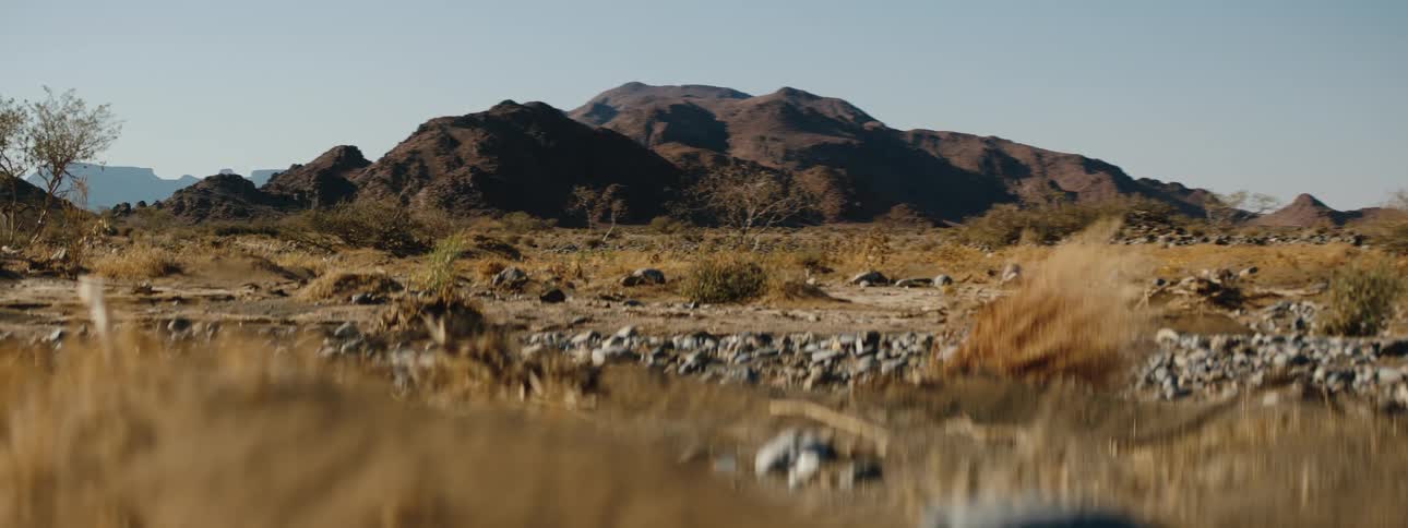 Wide shot of mountains in the desert