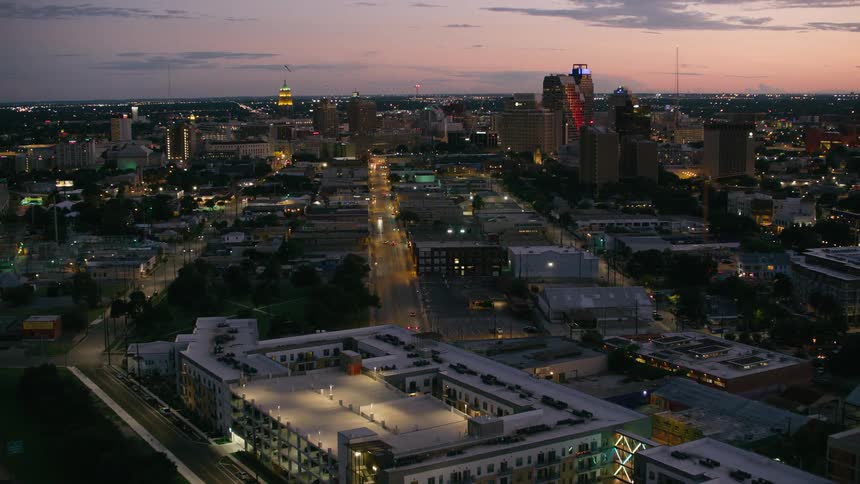 Traffic flows over network of freeways passing city downtown