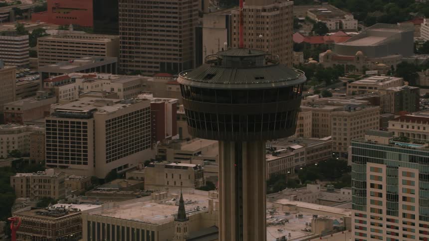 Space needles stands among skyscrapers downtown as traffic flows along highways