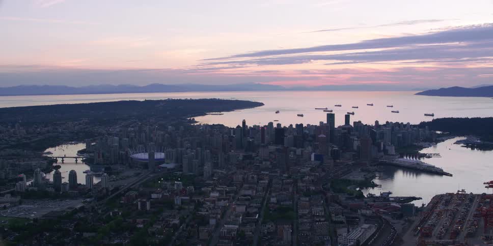 Aerial view of a downtown city is displayed at dusk