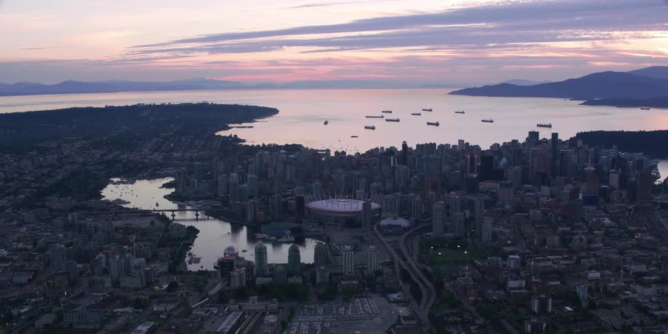 An ocean spills into rivers that run through a downtown city