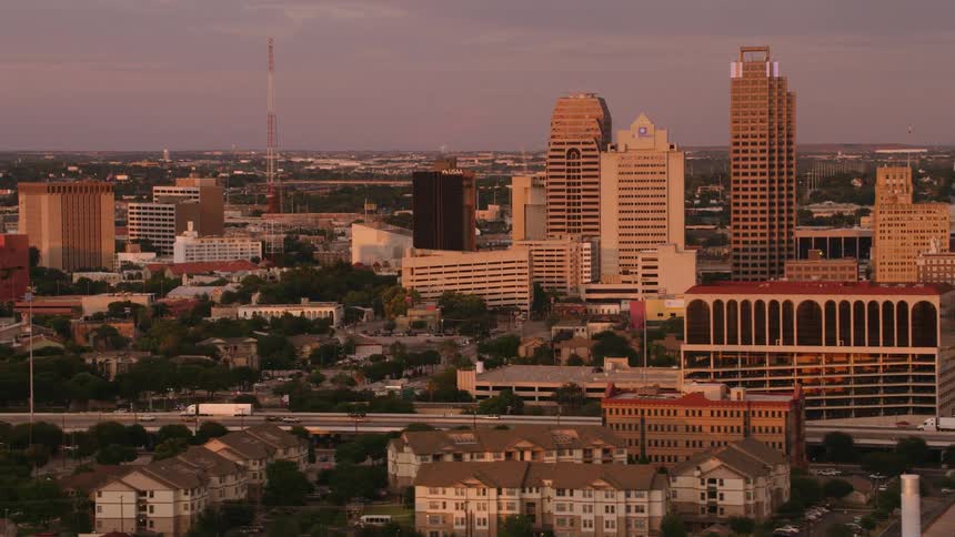 Aerial view of a downtown city is displayed at dusk