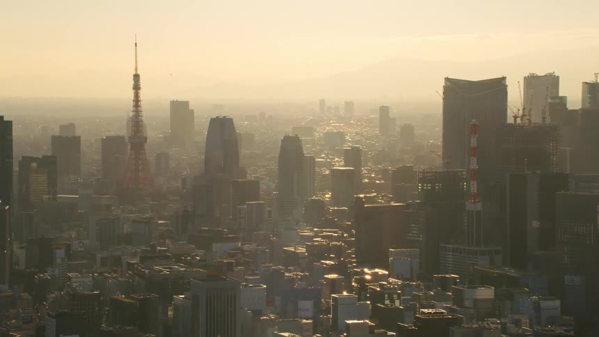 Tower stands in middle of smog covered city