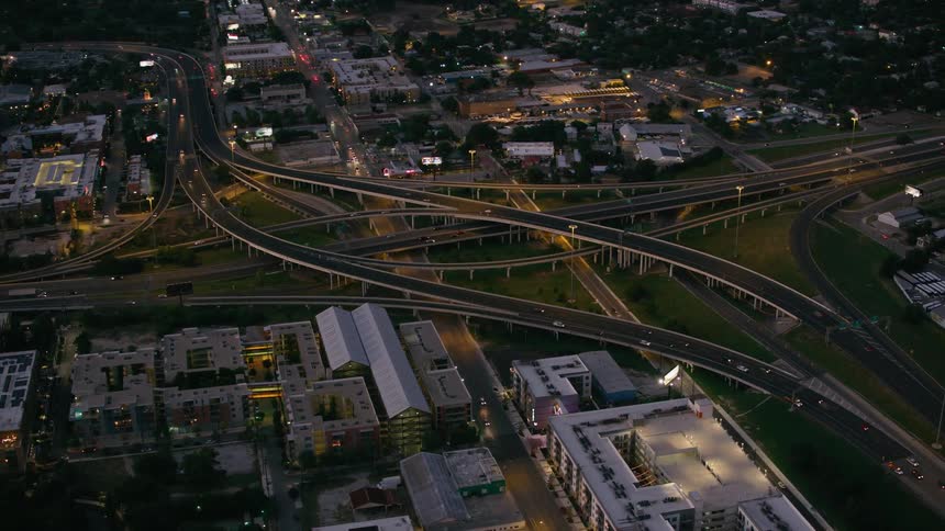 Aerial view of cars driving on highways in a city
