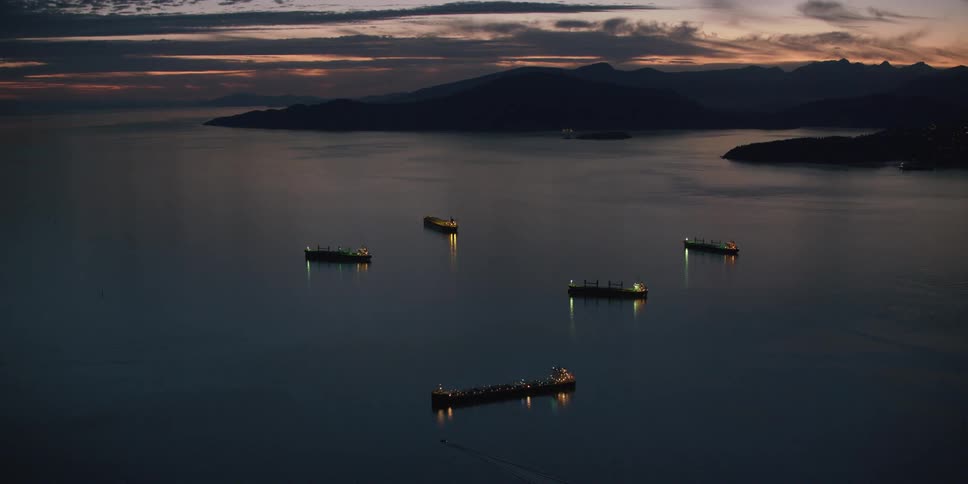 Boats are anchored in the water offshore