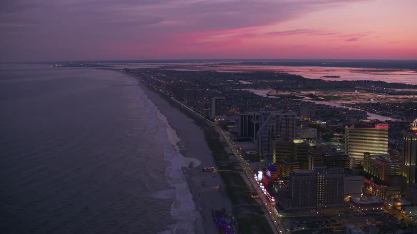 Buildings and houses in a coastal city after sunset