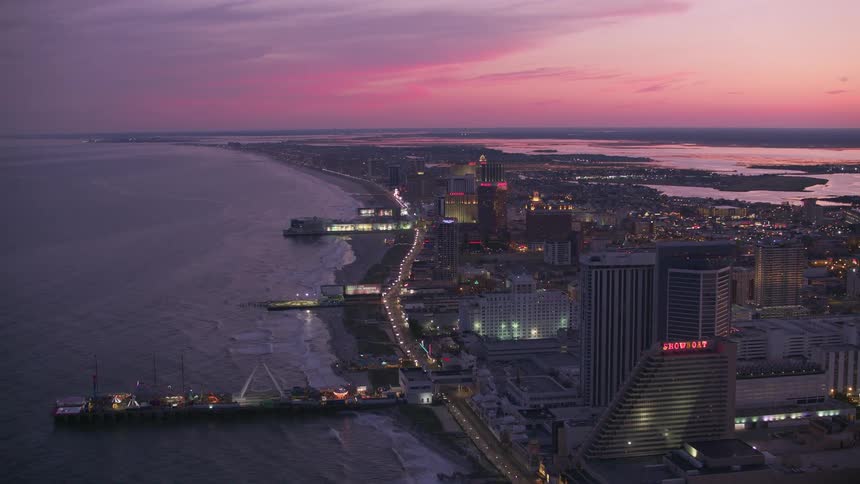 Aerial view of a city near the beach coast at dusk