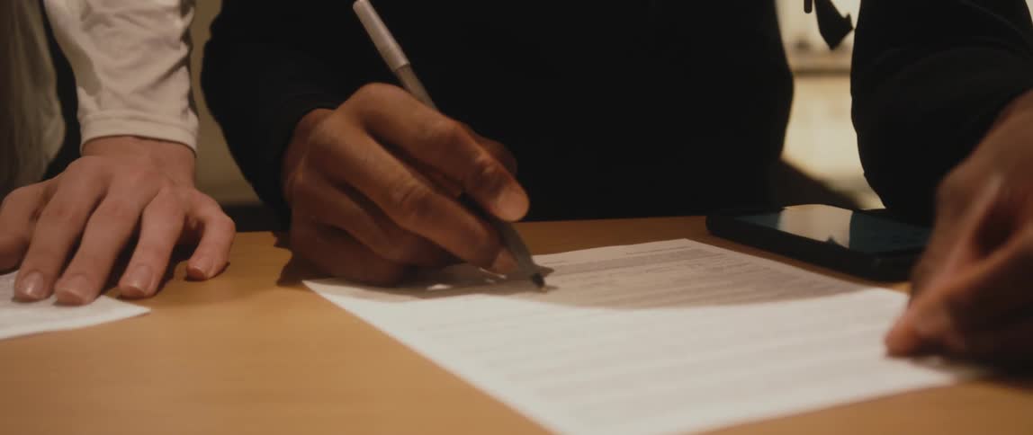 People are filling out paperwork