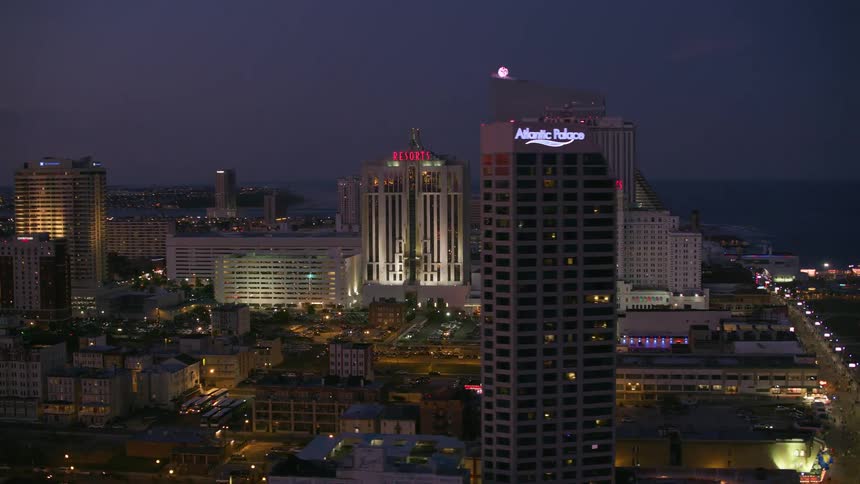 Aerial view of a downtown city at night is displayed