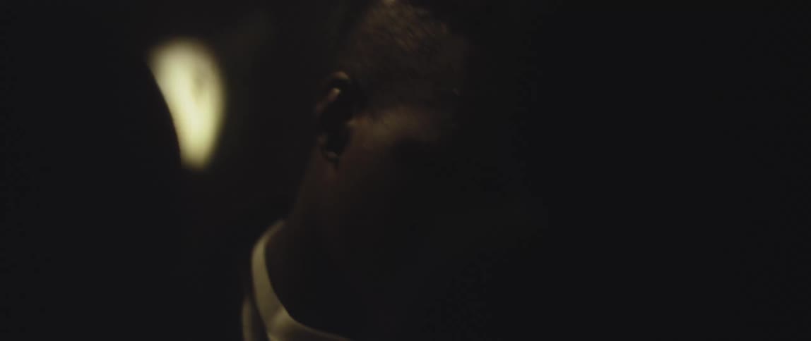 A man is leaning to the side and shaking