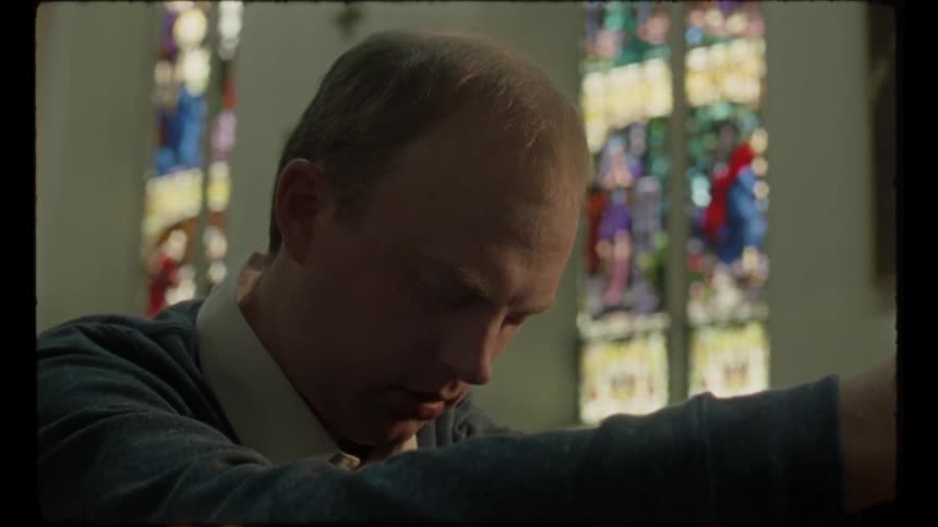 A man is praying in church