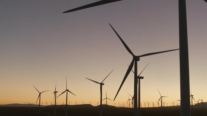 Wind turbines in a field on a wind farm