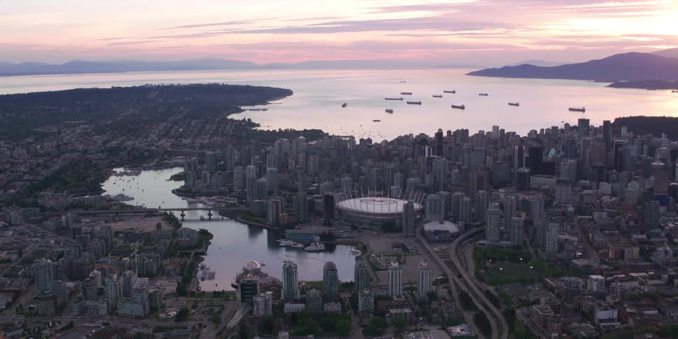 An aerial view of a city at sunset
