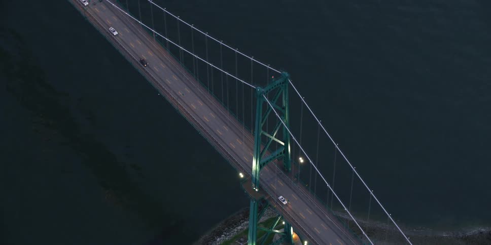 The cars drive over the bridge