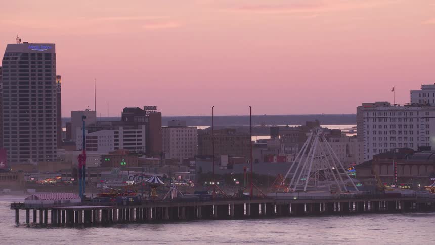 Lights flashing on the amusement park rides on the pier in atlantic city