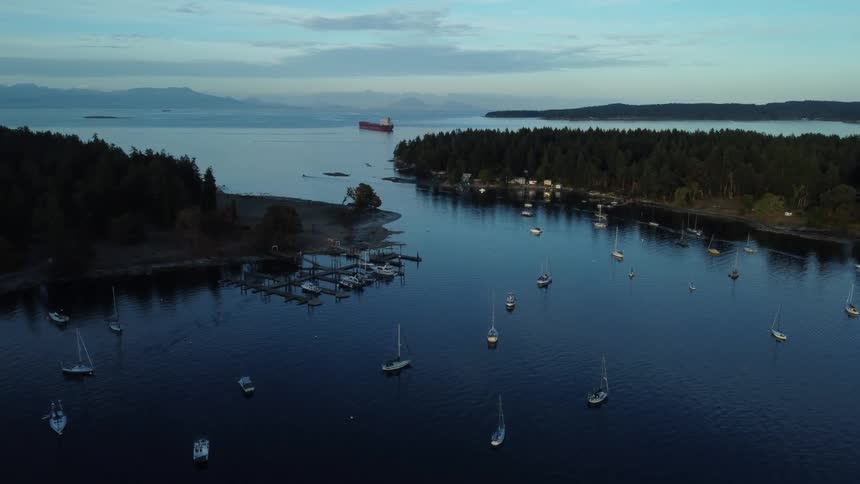 Boats sail in a cove between peninsulas
