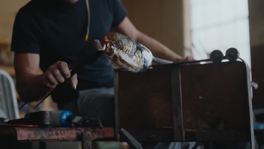 Craftsman enjoys working on a vase