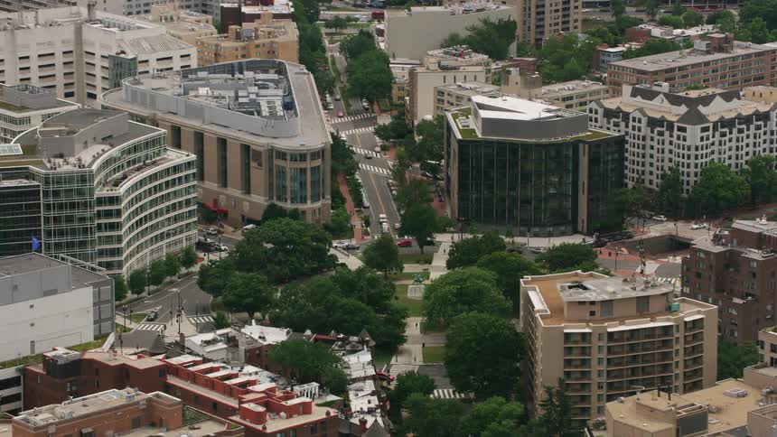 Aerial view of public park surrounded by buildings in the city