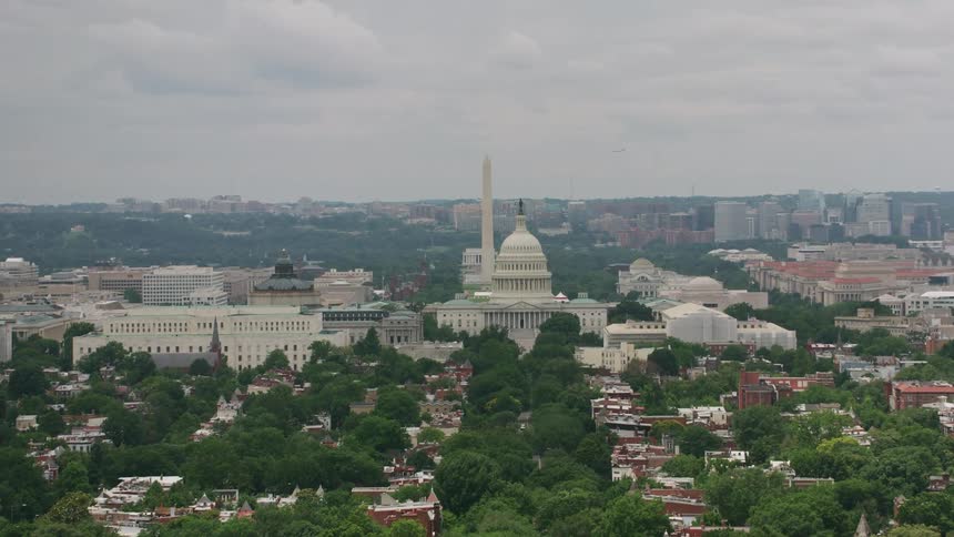 A large domed building is in the city