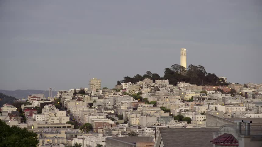 A tower ties in the distance above a town