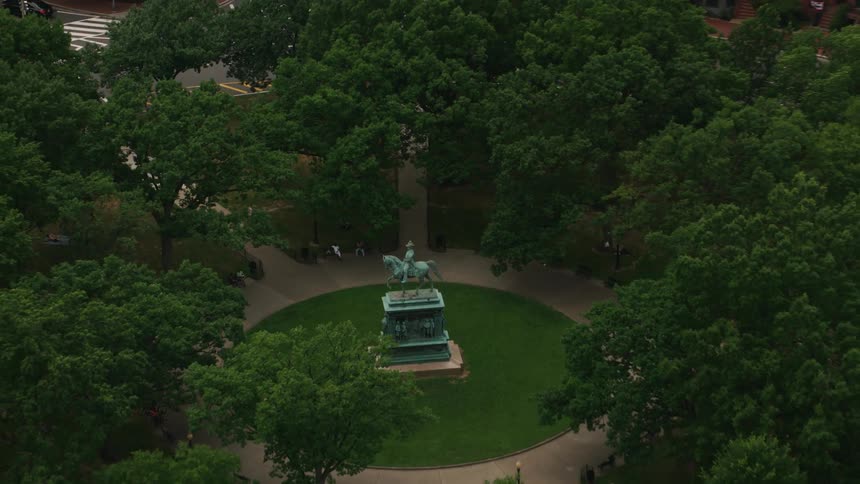 A large statue is at the center of the city