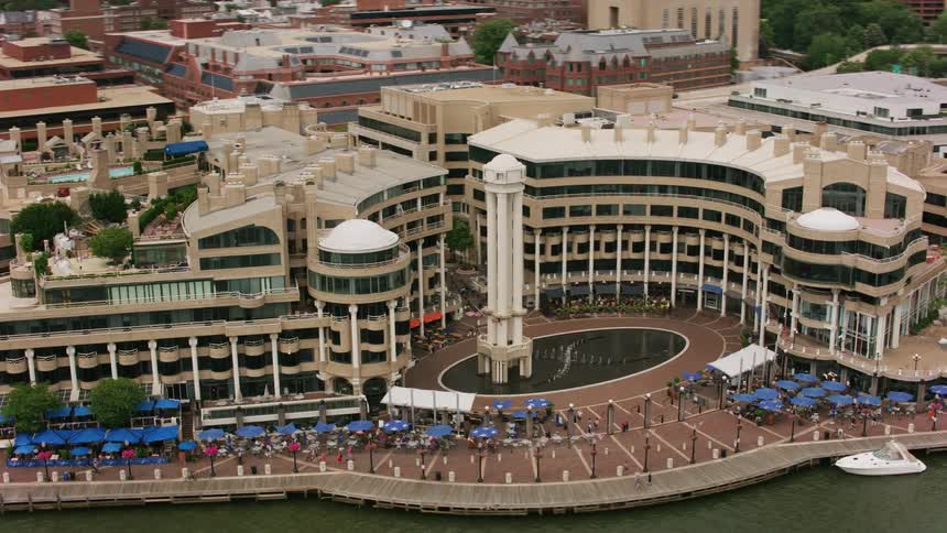 A large building on a waterfront in a city during the day