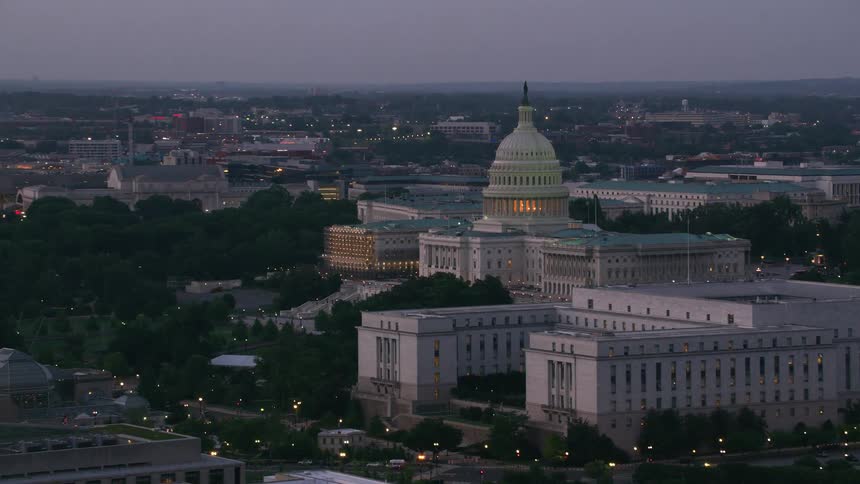 Aerial view of the dome of the united states capitol building with statue of freedomat dusk
