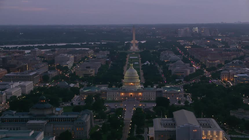 The us capitol building and washington monument and mall at dusk
